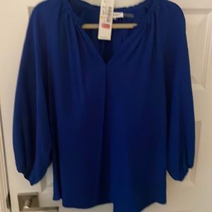 New with tags - Calvin Klein beautiful royal blue top. Elastic push up sleeves